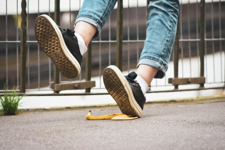 AI content production mistakes. Person slipping on a banana peel